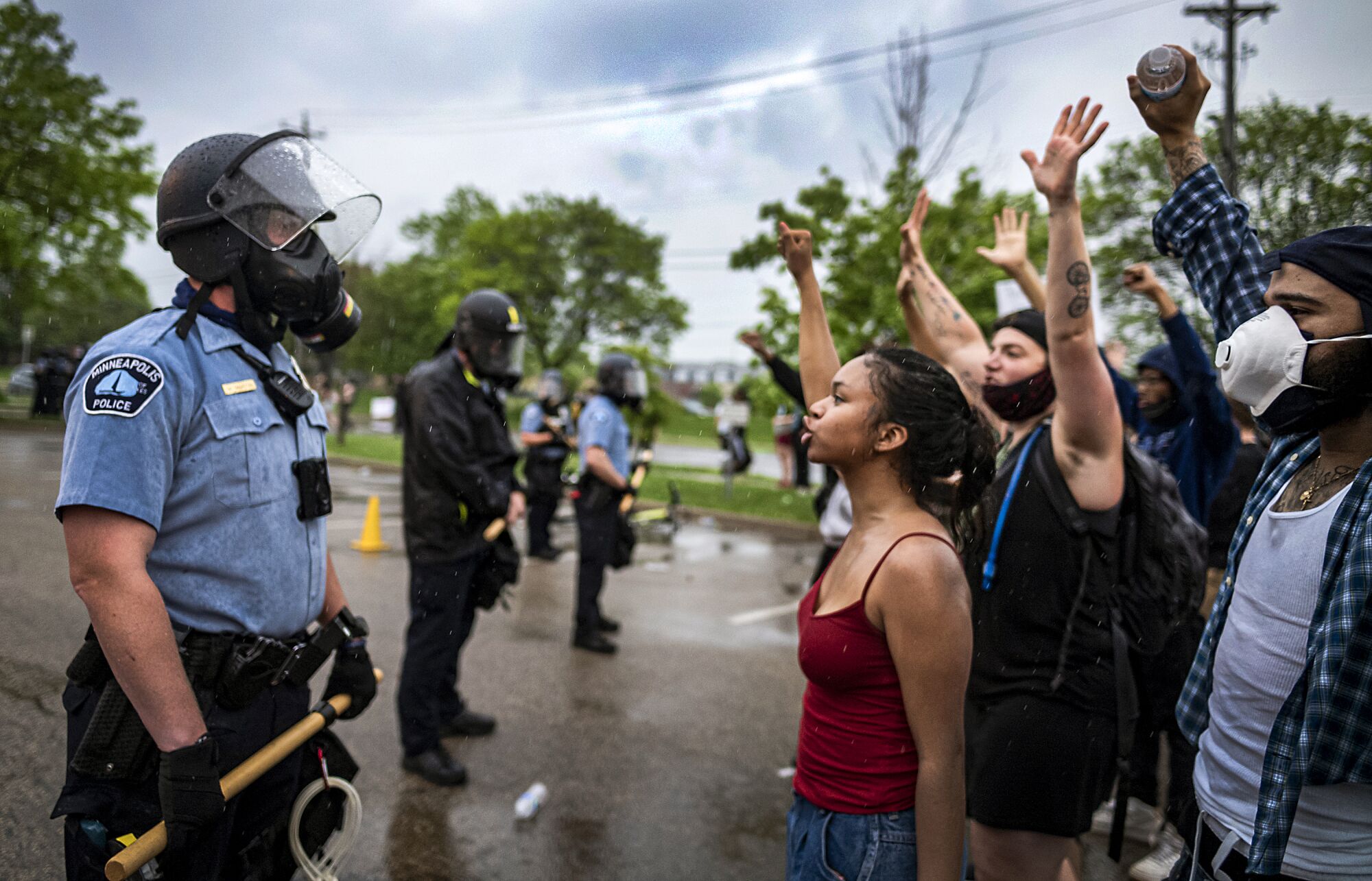 Protesters and police face each other during a rally in Minneapolis after the death of George Floyd.