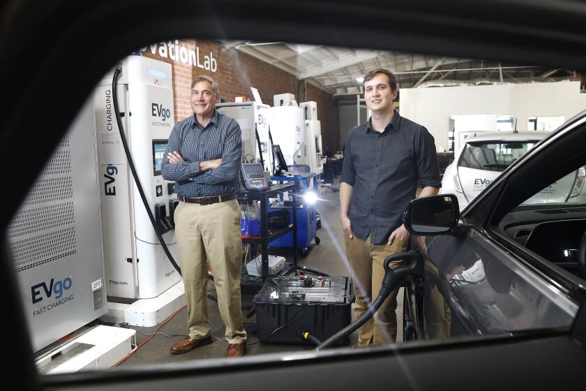 EL SEGUNDO-CA-APRIL 25, 2023: Engineers Keith Beckstead, left, and Bryce Wynter, right, are photographed at EVgo Innovation Lab in El Segundo on April 25, 2023. (Christina House / Los Angeles Times)