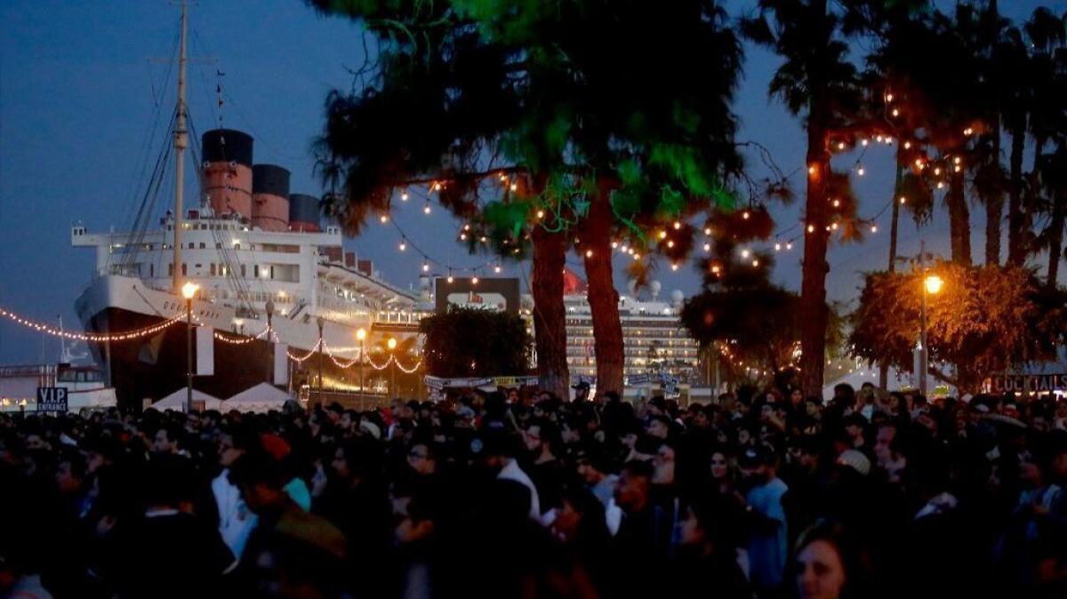 A crowd attending the Tropicalia Music & Taco Festival in the Queen Mary Park in Long Beach.