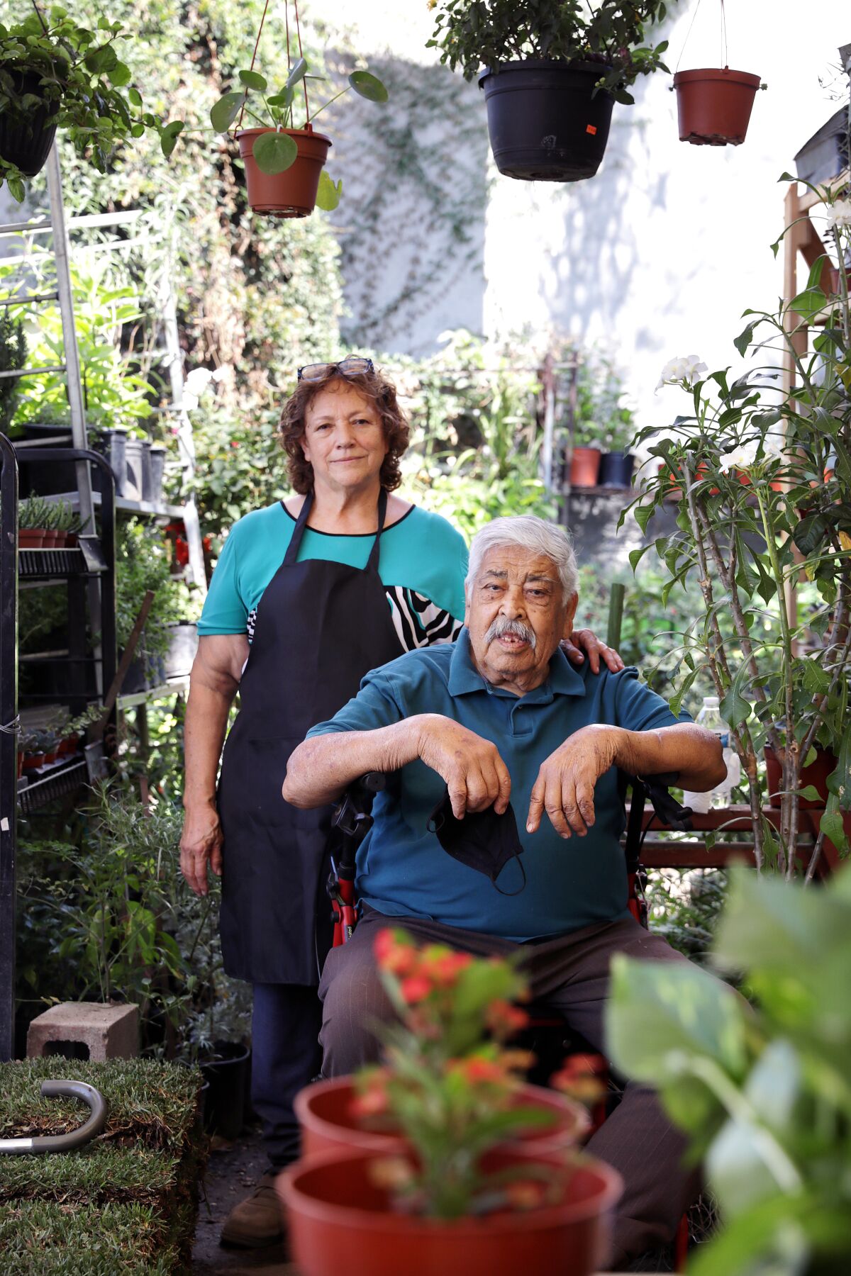 Maria Luz Lopez with her husband, Alfredo, at the South L.A. business Maria started in 1987,  Avalon Nursery & Ceramics.