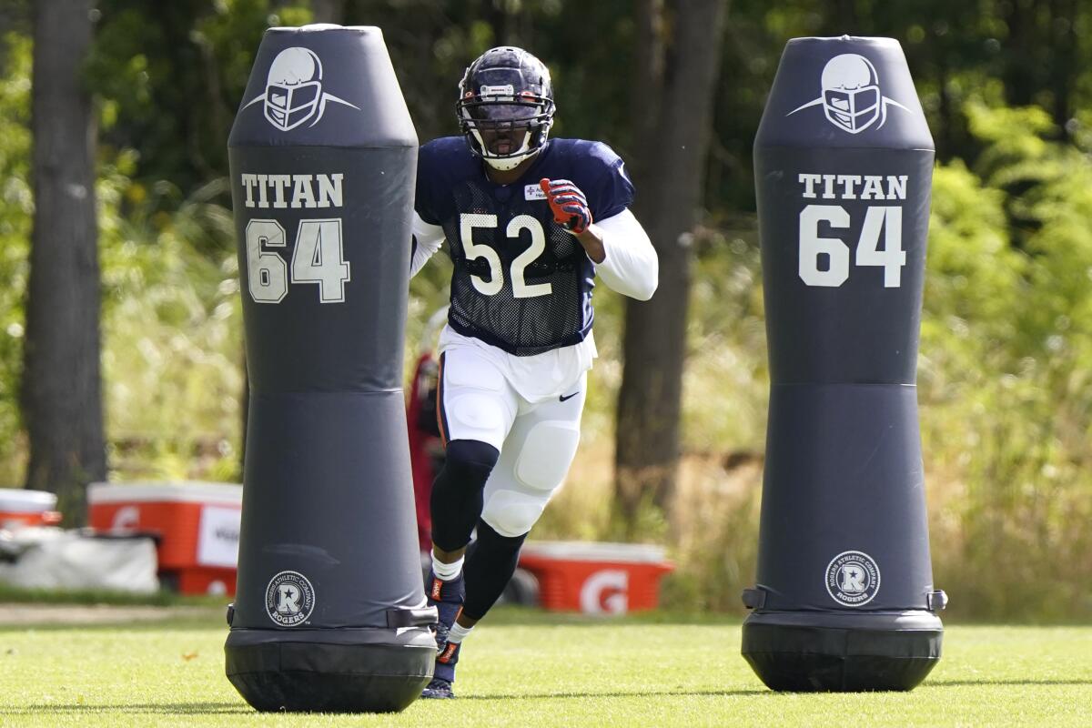 Chicago Bears linebacker Khalil Mack runs a drill during an NFL football camp practice in Lake Forest, Ill., Tuesday, Aug. 18, 2020. (AP Photo/Nam Y. Huh, Pool)