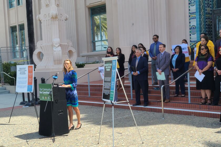 County Supervisor Terra Lawson-Remer speaks at a press conference celebrating the Immigrant Rights Legal Defense Program