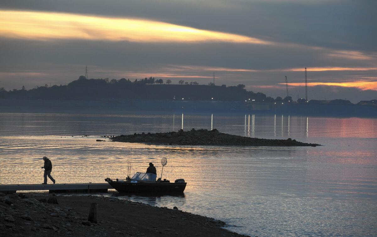 Fishermen dock at Brown's Ravine Recreation Area on Folsom Lake, where the water level is rising.