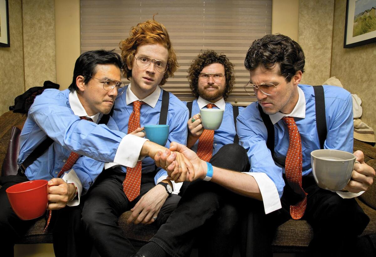 Dressed as "Office Space" characters for the Beach Goth festival in Santa Ana are, from left, FIDLAR singer-guitarist Zac Carper, drummer Max Kuehn, lead guitarist-singer Elvis Kuehn and bassist Brandon Schwartzel.