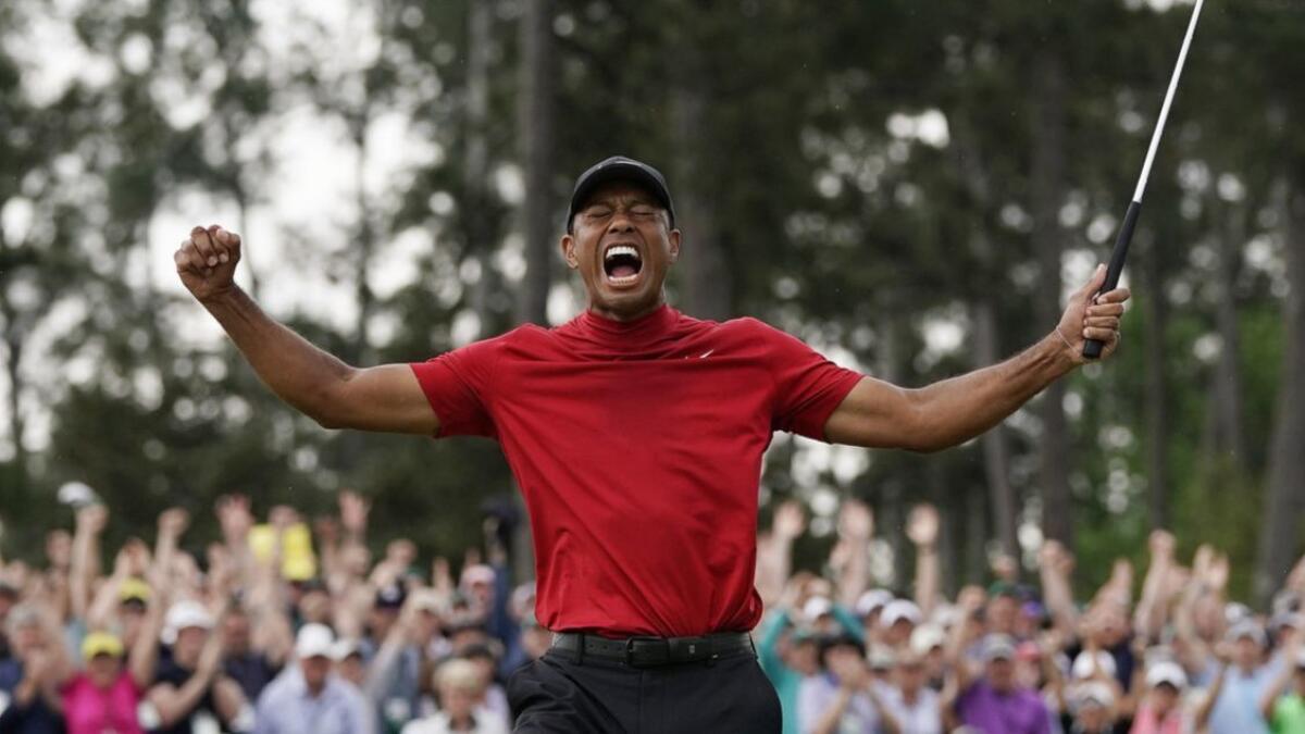 Tiger Woods reacts as he wins the Masters in early April.