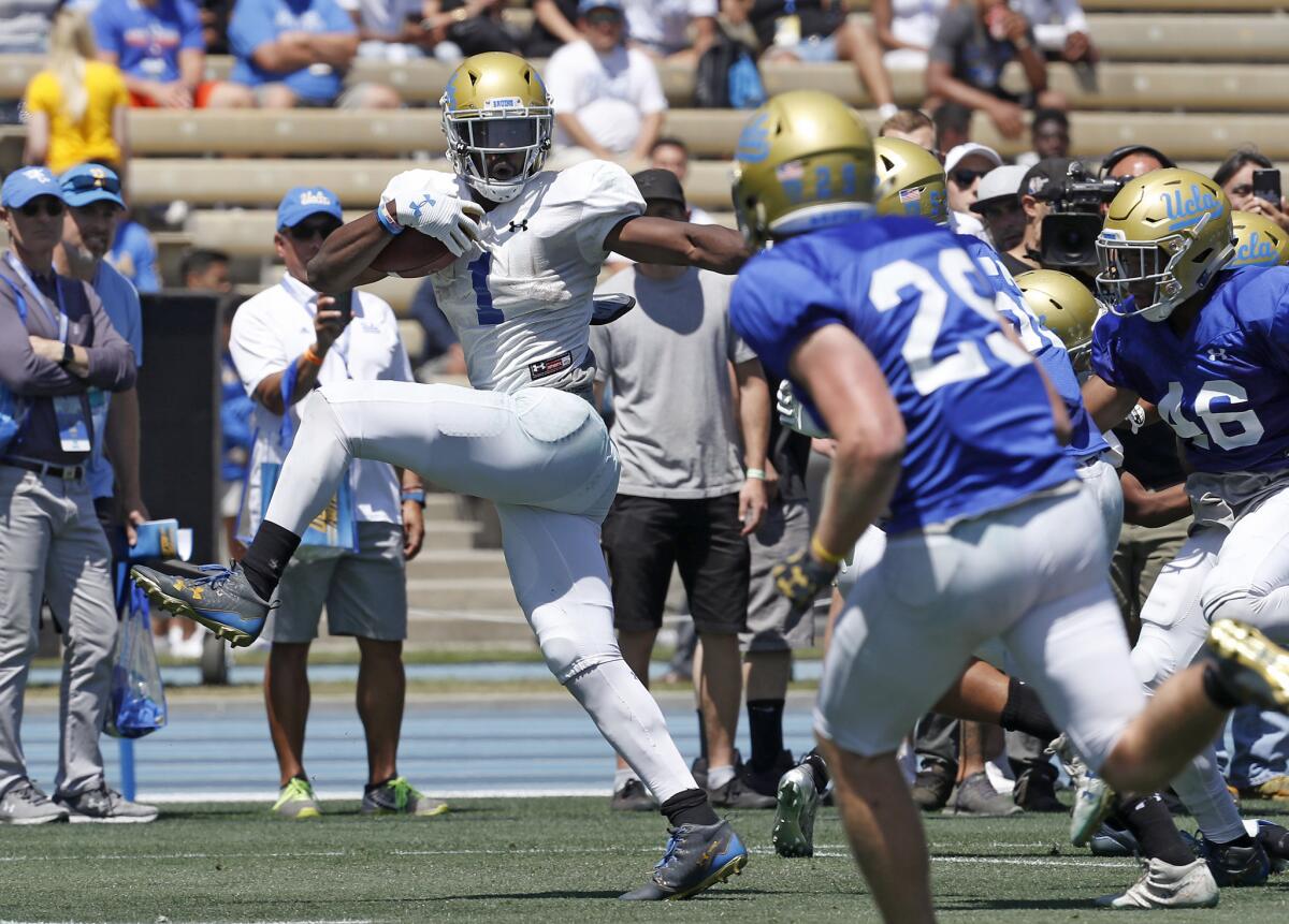 UCLA running back Soso Jamabo breaks free for a long gain during the Bruins' spring football game at Drake Stadium on April 21.