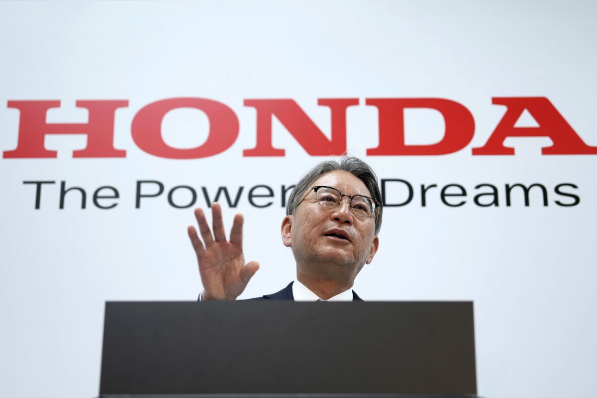 Honda Motor Co. Chief Executive Toshihiro Mibe answers questions from media during a press conference Tuesday, April 12, 2022, in Tokyo. (AP Photo/Eugene Hoshiko)