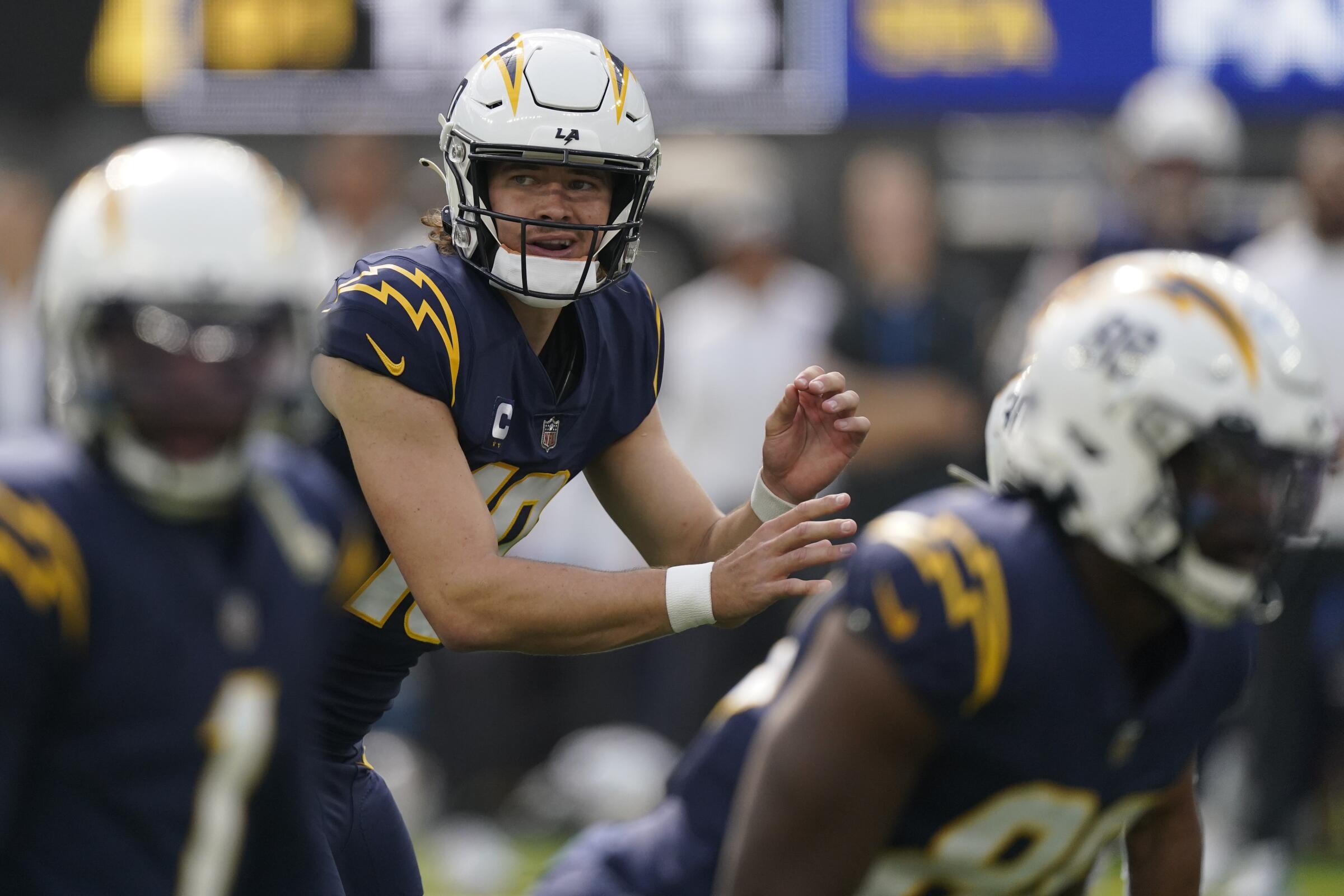 Chargers quarterback Justin Herbert prepares to snap the ball during a loss to the Seattle Seahawks on Oct. 23.