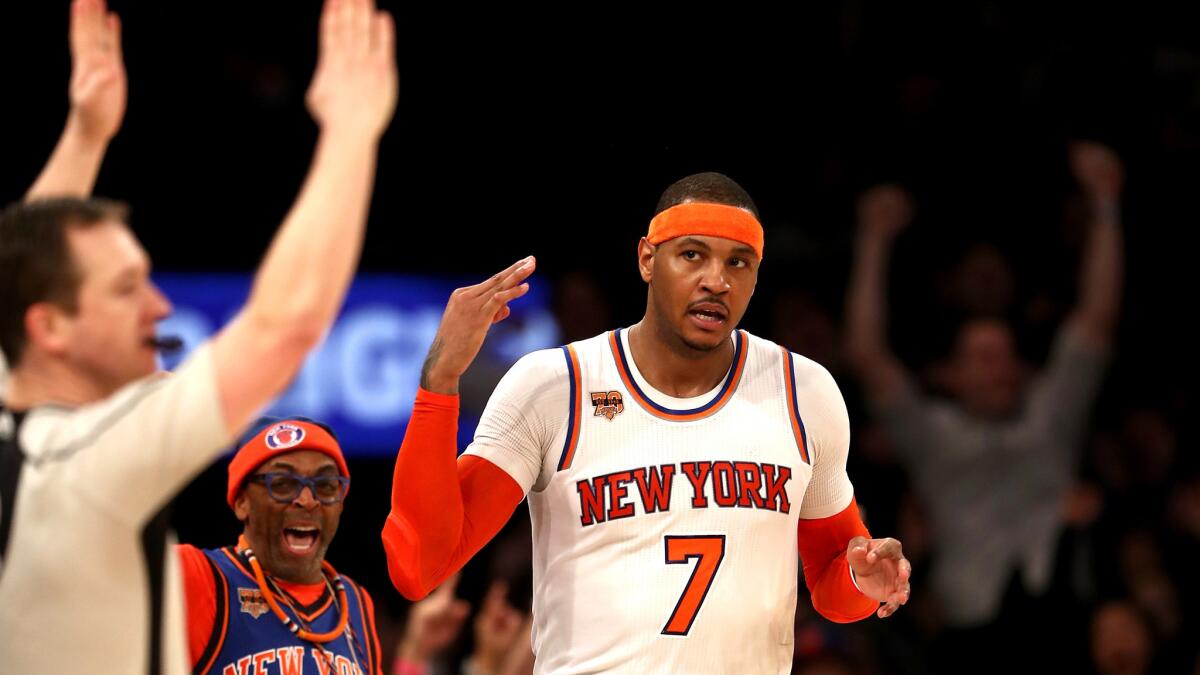 Knicks forward Carmelo Anthony celebrates his three-point basket in the final minutes of the game against the Spurs on Sunday.