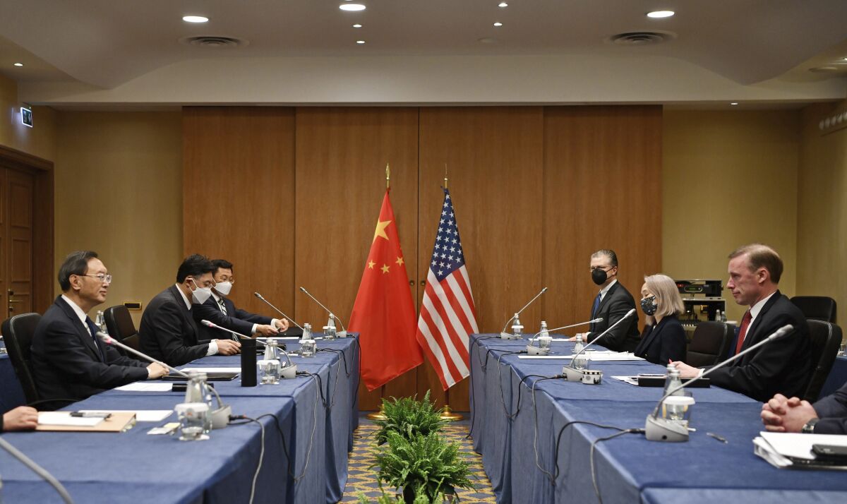 In this photo released by Xinhua News Agency Yang Jiechi, a member of the Political Bureau of the Communist Party of China (CPC) Central Committee and director of the Office of the Foreign Affairs Commission of the CPC Central Committee, at left meets with U.S. National Security Advisor Jake Sullivan at right in Rome, Italy, March 14, 2022. Face to face, President Joe Biden's national security adviser warned the top Chinese official on Monday about China's support for Russia in the Ukrainian invasion, even as the Kremlin denied reports it had requested Chinese military equipment to use in the war. (Jin Mamengni/Xinhua via AP)
