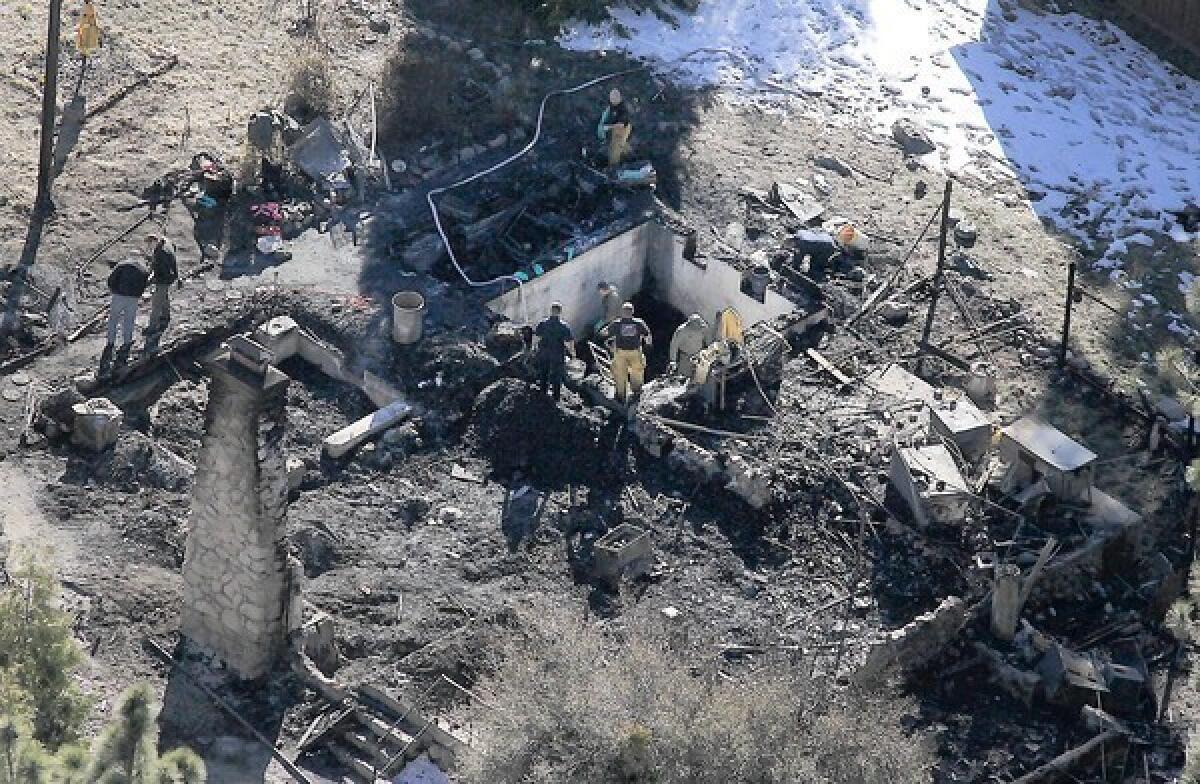 Investigators on Wednesday were tryng to identify the human remains found in the charred cabin where fugitive ex-LAPD Officer Christopher Dorner was believed to have been holed up after trading gunfire with officers near Big Bear, authorities said.
