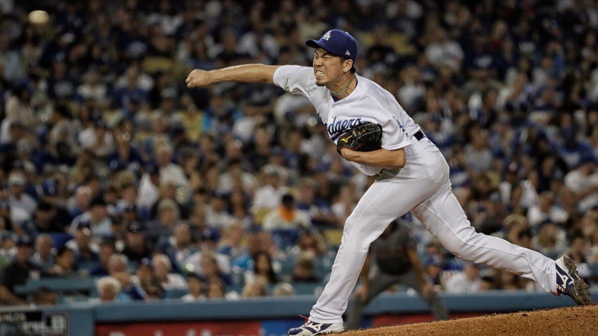Dodgers reliever Kenta Maeda delivers a pitch in the fifth inning, holding the DBacks scoreless in Game 2 of the NLDS at Dodger Stadium.