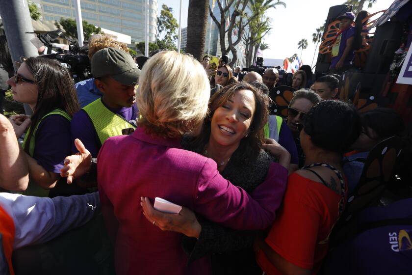 LOS ANGELES, CA - OCTOBER 2, 2019 - - Senator Kamala Harris, facing, hugs Los Angeles County Supervisor Janice Hahn after Harris addressed hundreds of airport workers, Uber and Lyft drivers, janitors, city and county workers on Century Blvd. near the Los Angeles International Airport in Los Angeles on October 2, 2019. Sen. Harris and Supervisor Hahn were there to show her support to workers and there rights. The marchers are demanding that elected officials, locally, statewide and federally, take action to support unions for all people--no matter where they work. Workers also marched for better pay and benefits and want to unionize. (Genaro Molina / Los Angeles Times)