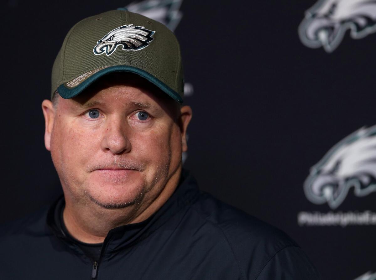 Eagles Coach Chip Kelly pauses during an NFL football news conference.