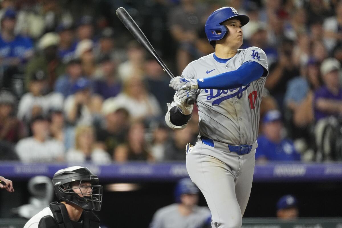 Dodgers clinch MLB's greatest file as Shohei Ohtani continues triple-crown chase 1 The Dodgers' Shohei Ohtani flies out against the Colorado Rockies in the seventh inning Saturday in Denver.