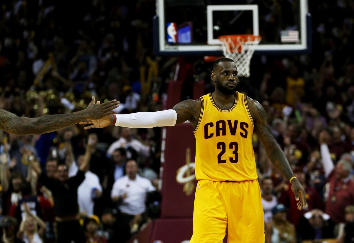 Cavaliers forward LeBron James reacts during the third quarter of Game 3 of the NBA Finals against the Golden State Warriors.