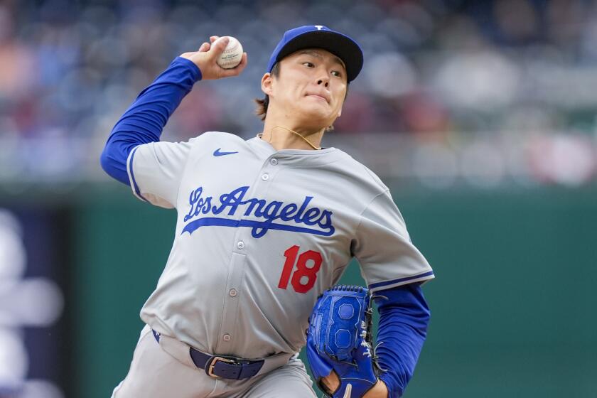 Los Angeles Dodgers pitcher Yoshinobu Yamamoto throws during the third inning of a baseball.