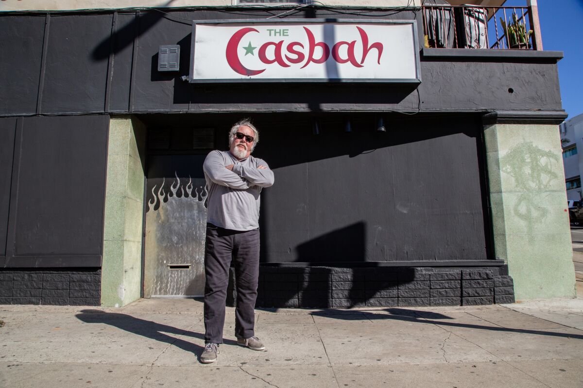 File photo of the Casbah owner Tim Mays posing outside of the live music venue and bar in midtown, which is temporarily shut down.