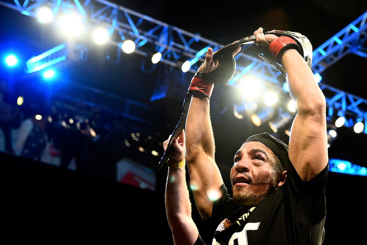 Jose Aldo celebrates after his unanimous-decision victory over Chad Mendes in their featherweight championship bout Saturday at UFC 179 in Rio de Janeiro, Brazil. (Photo by Buda Mendes/Getty Images) ** OUTS - ELSENT, FPG - OUTS * NM, PH, VA if sourced by CT, LA or MoD **