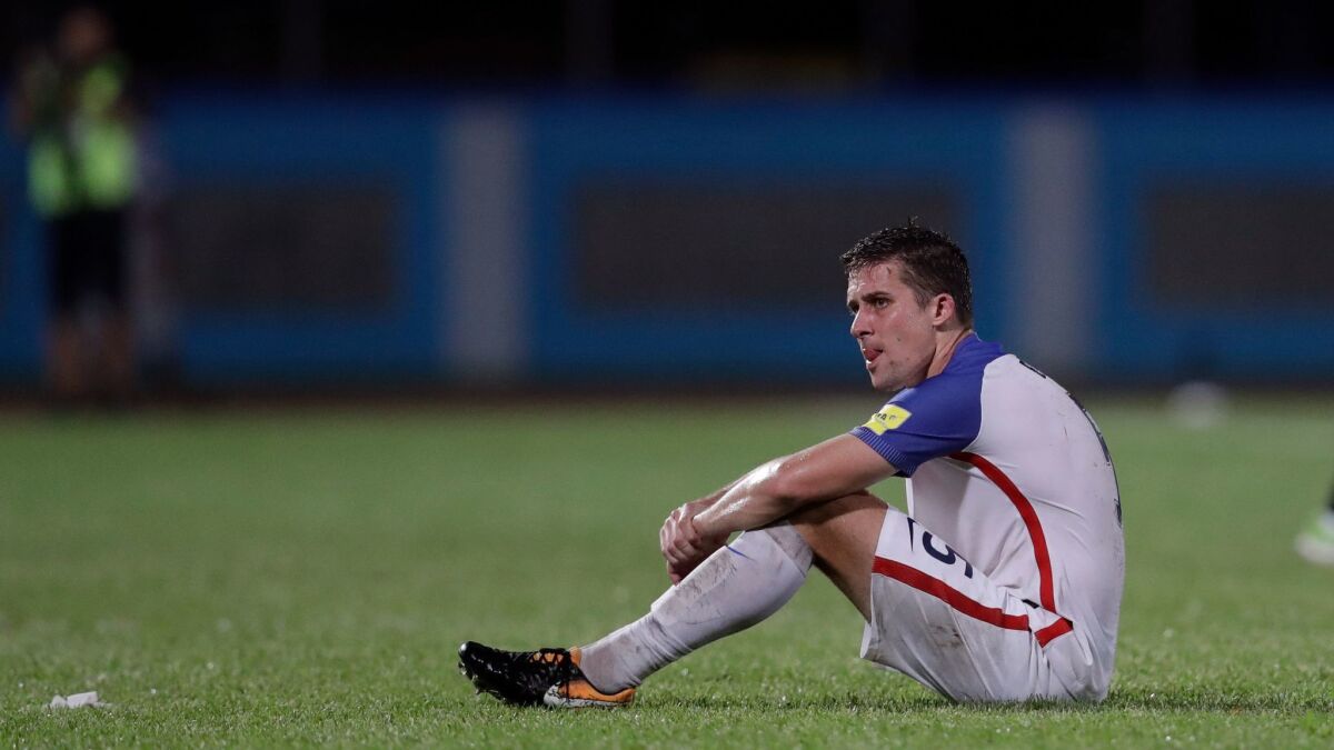 United States' Matt Besler, sits on the pitch after losing 2-1 against Trinidad and Tobago during a 2018 World Cup qualifying soccer match in Couva, Trinidad on Oct. 10.
