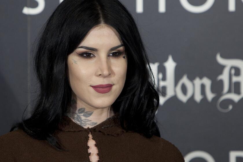 FILE - Tattoo artist Kat Von D poses for photographers during the presentation of her new line of makeup in Madrid, Spain, Oct. 7, 2015. On Friday, Jan. 26, 2024, a jury found that celebrity tattoo artist Kat Von D did not violate a photographer's copyright when she used his portrait of Miles Davis as the basis for a tattoo she put on the arm of a friend. (AP Photo/Abraham Caro Marin, File)