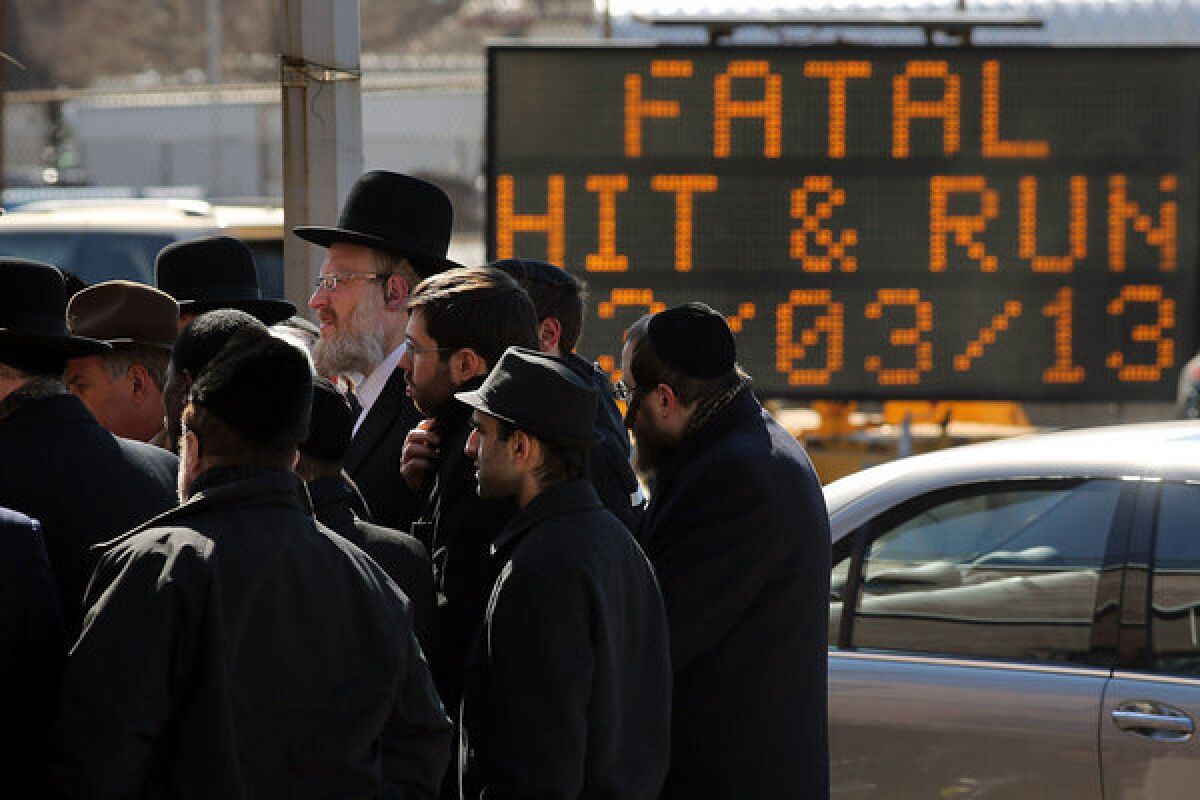 Members of the Brooklyn Orthodox Jewish community attend a news conference Monday to discuss the deaths of an Orthodox couple in a hit-and-run crash, and the death of their baby, prematurely delivered afterward.