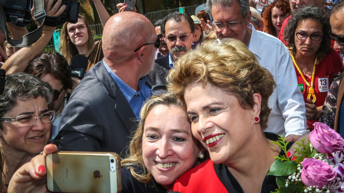 Former Brazilian President Dilma Rousseff with voters on Sunday, the day of municipal elections across Brazil.