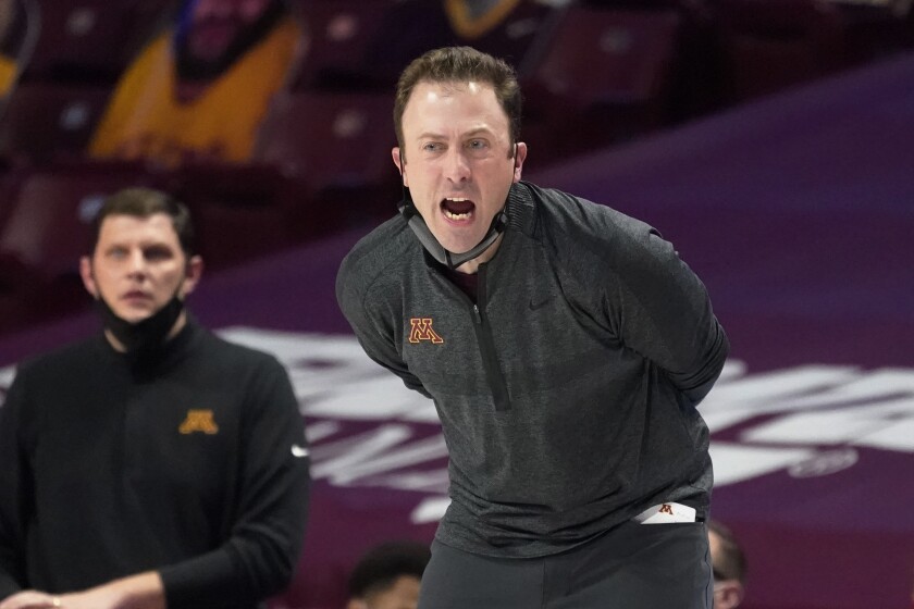 Minnesota head coach Richard Pitino directs his players in the second half of an NCAA college basketball game against Northwestern, Thursday, Feb. 25, 2021, in Minneapolis. (AP Photo/Jim Mone)