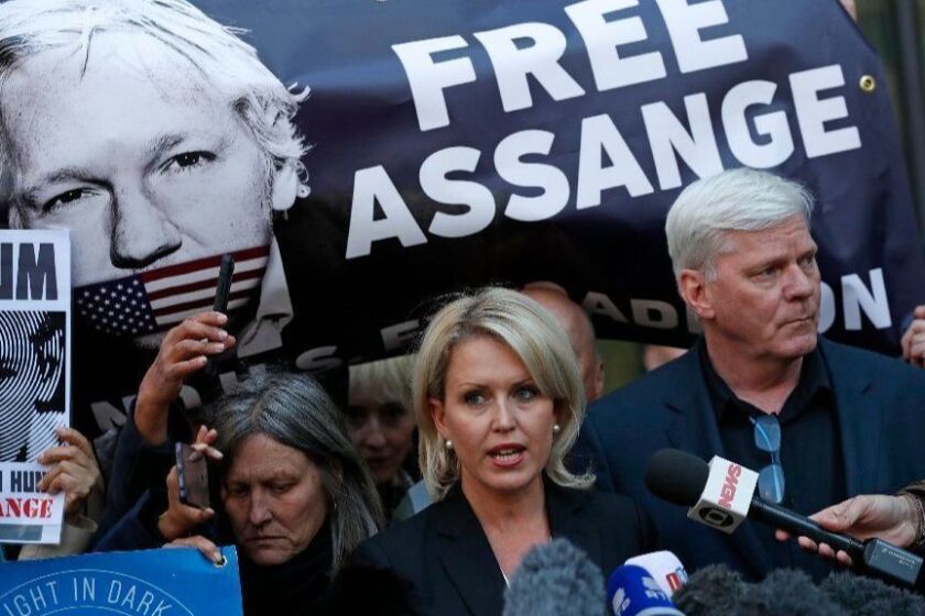 Kristinn Hrafnsson, editor of WikiLeaks, right, and barrister Jennifer Robinson speak to the media outside Westminster magistrates court where WikiLeaks founder Julian Assange was appearing in London, Thursday, April 11, 2019. WikiLeaks founder Julian Assange was forcibly bundled out of the Ecuadorian Embassy in London and into a waiting British police van on Thursday, setting up a potential court battle over attempts to extradite him to the U.S. to face charges related to the publication of tens of thousands of secret government documents. (AP Photo/Alastair Grant)