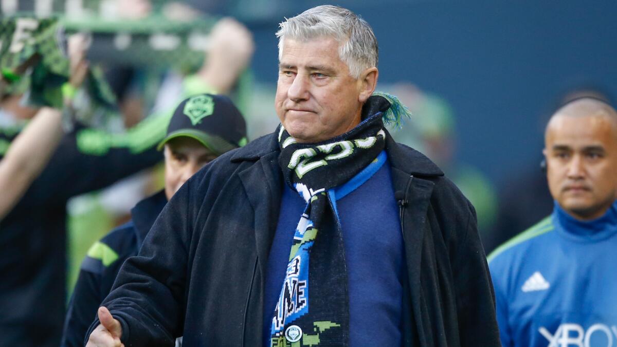 Seattle Sounders Coach Sigi Schmid walks onto the field before a match against the New England Revolution last month.