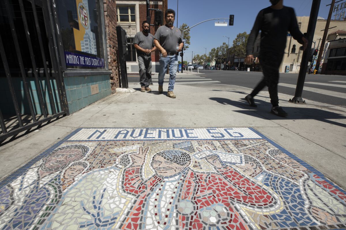 Pedestrians on Figueroa Street in Highland Park.