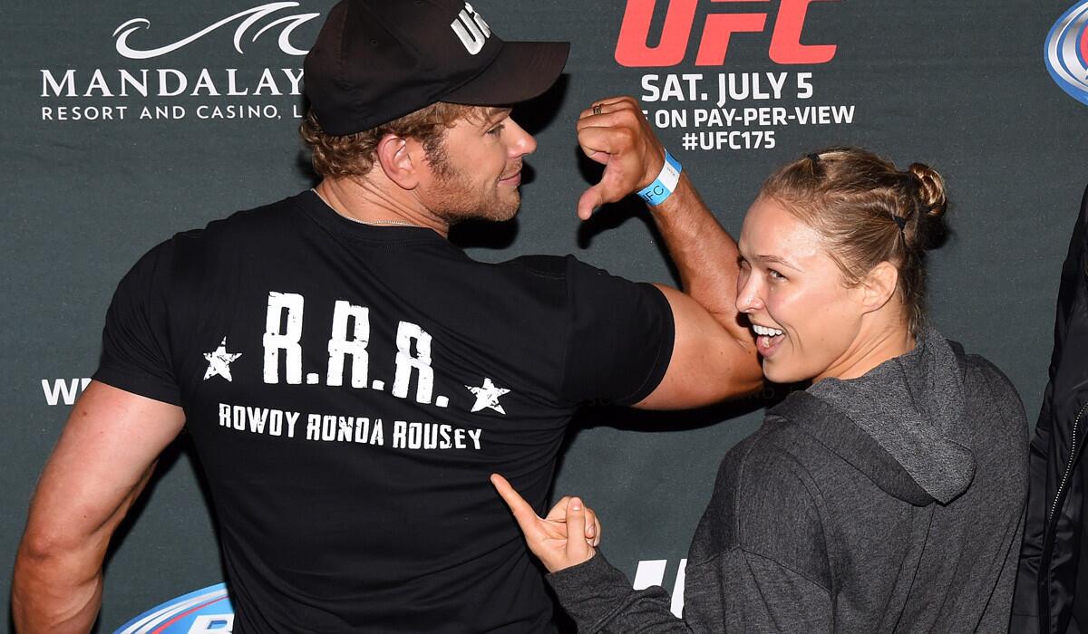 Ronda Rousey and fellow "The Expendables 3" cast member Kellan Lutz show off a T-shirt with her nickname before UFC 175 in Las Vegas on July 5.