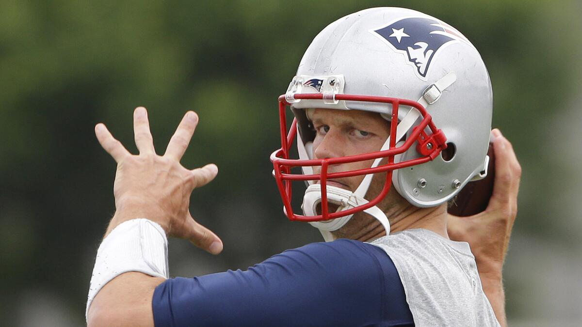 New England Patriots quarterback Tom Brady throws a pass during a minicamp training session in Foxborough, Mass., on June 16.