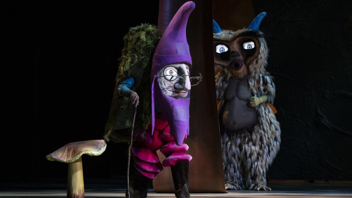 A purple gnome and an owl during a scene in L.A. Opera's "Hansel and Gretel at the Dorothy Chandler Pavilion.