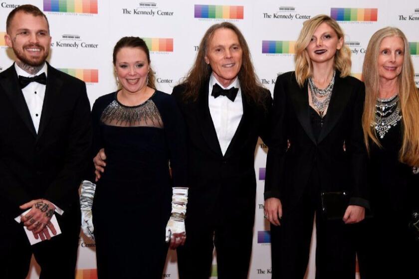 2016 Kennedy Center Honors recipient Timothy B. Schmit of the Eagles (center) poses with his wife Jean (right), daughter Owen (second from right), son Ben (left) and daughter Jeddrah (second from left) as they arrive for a gala dinner Dec. 3 in Washington, D.C.