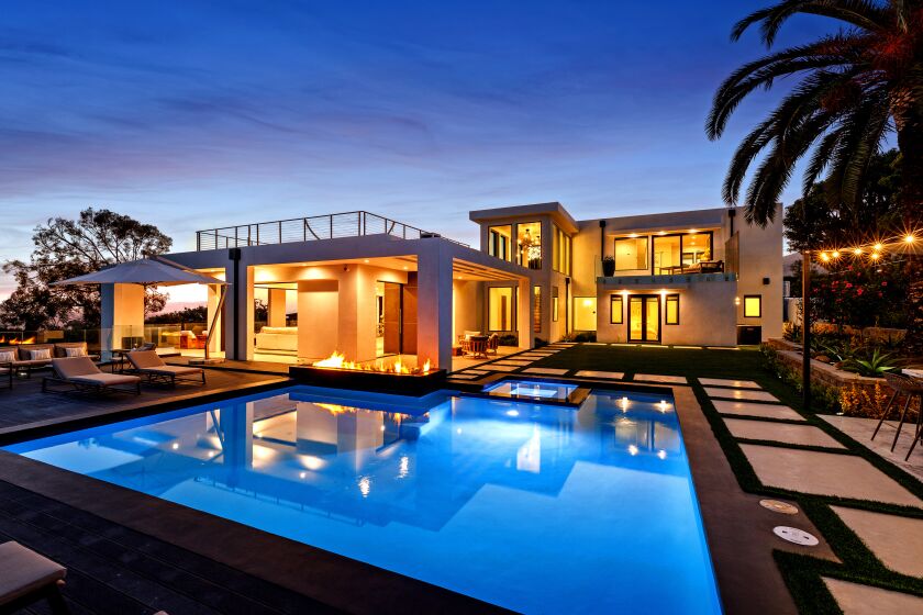 The newly-finished home near Zuma Beach is geared for indoor-outdoor living with pocketing walls, wrap-around terraces, balconies and a rooftop deck. Listed for $12 million, the contemporary-style house includes such amenities as a gym, movie theater and outdoor kitchen. Five bedrooms and six bathrooms are spread across two floors. Inside, some 6,500 square feet of interior features polished cement floors, artistic walls and a floating staircase. Walls of glass take in sweeping ocean views.