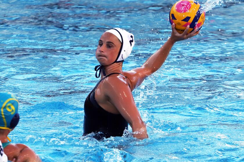 Maddie Musselman (2) from Newport Beach playing for Team U.S.A. women's water polo national team shoots for a goal against Team Australia women's water polo team in a exhibition match at Long Beach City College in Long Beach on Tuesday, April 9, 2024. (Photo by James Carbone)