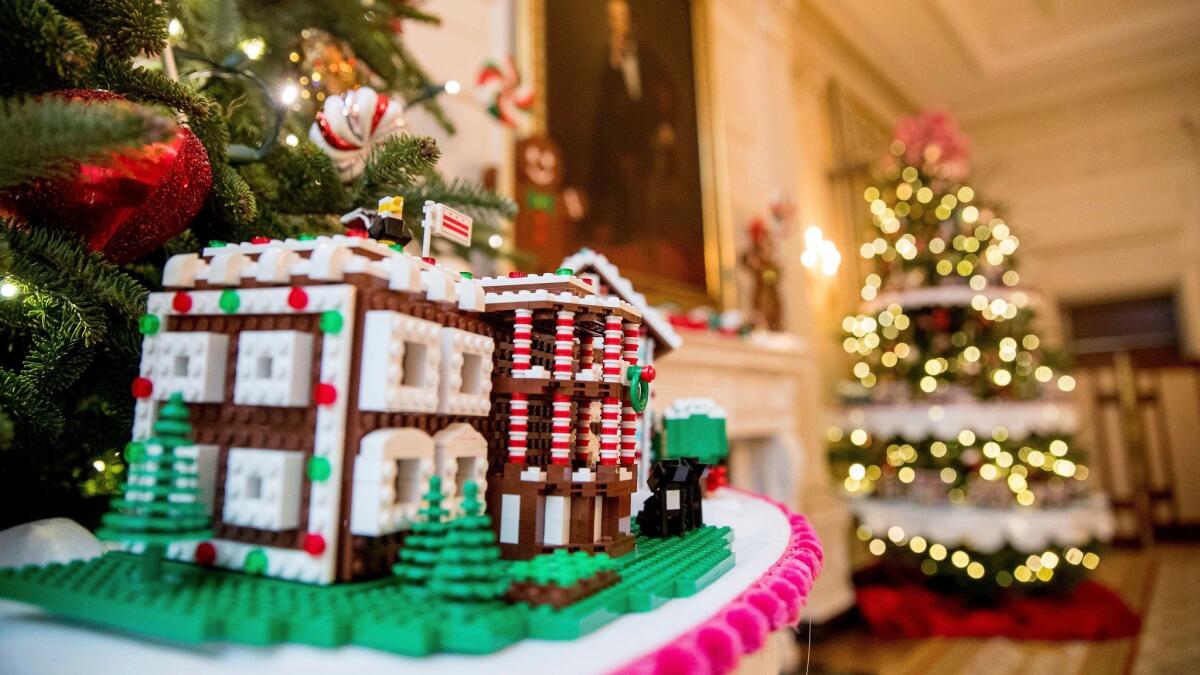 A Lego gingerbread White House is among 56 -- one for each U.S. state and territory -- on display inside the executive mansion this year.