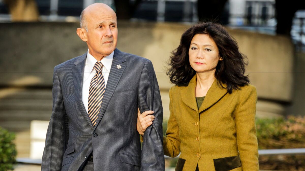 Former Los Angeles County Sheriff Lee Baca and wife, Carol Chiang, arrive at federal court earlier this month for his trial. Baca faces obstruction of justice and conspiracy charges.