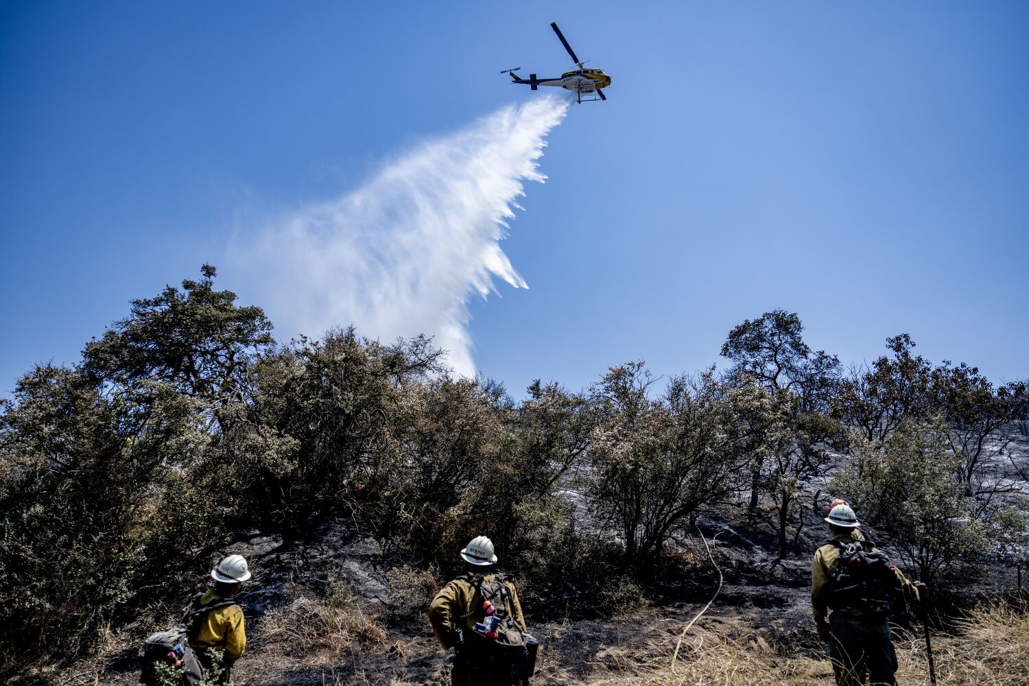 Firefighters battle 7,600-acre wildfire in Riverside County as heat wave scorches California