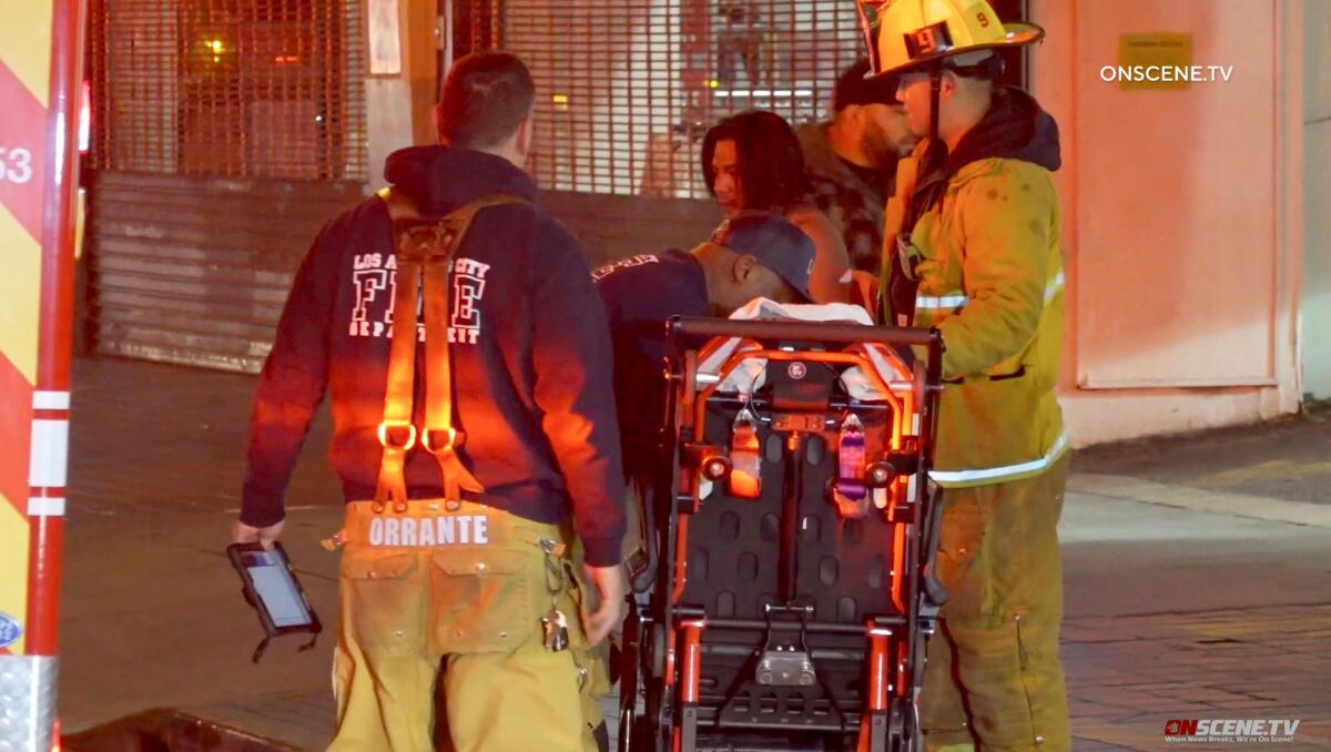 First responders tend to people on a downtown Los Angeles street.