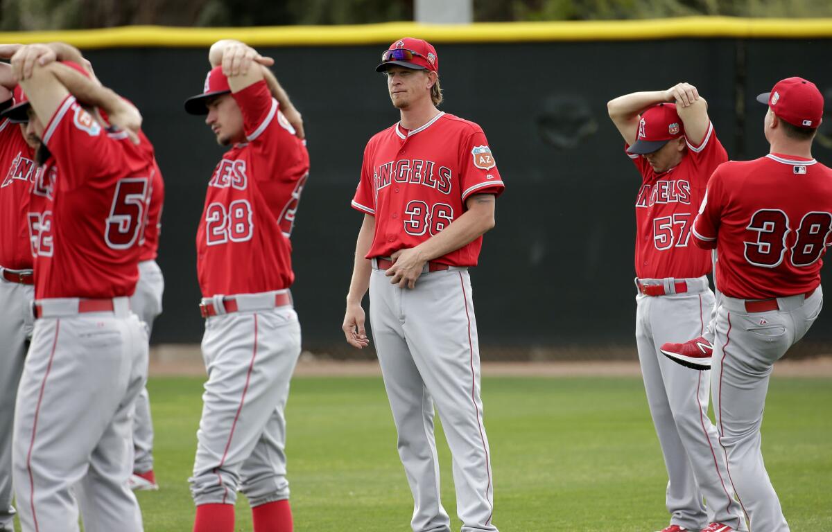 Angels starting pitcher Jered Weaver (36) watches during stretching drills during spring training baseball workouts.