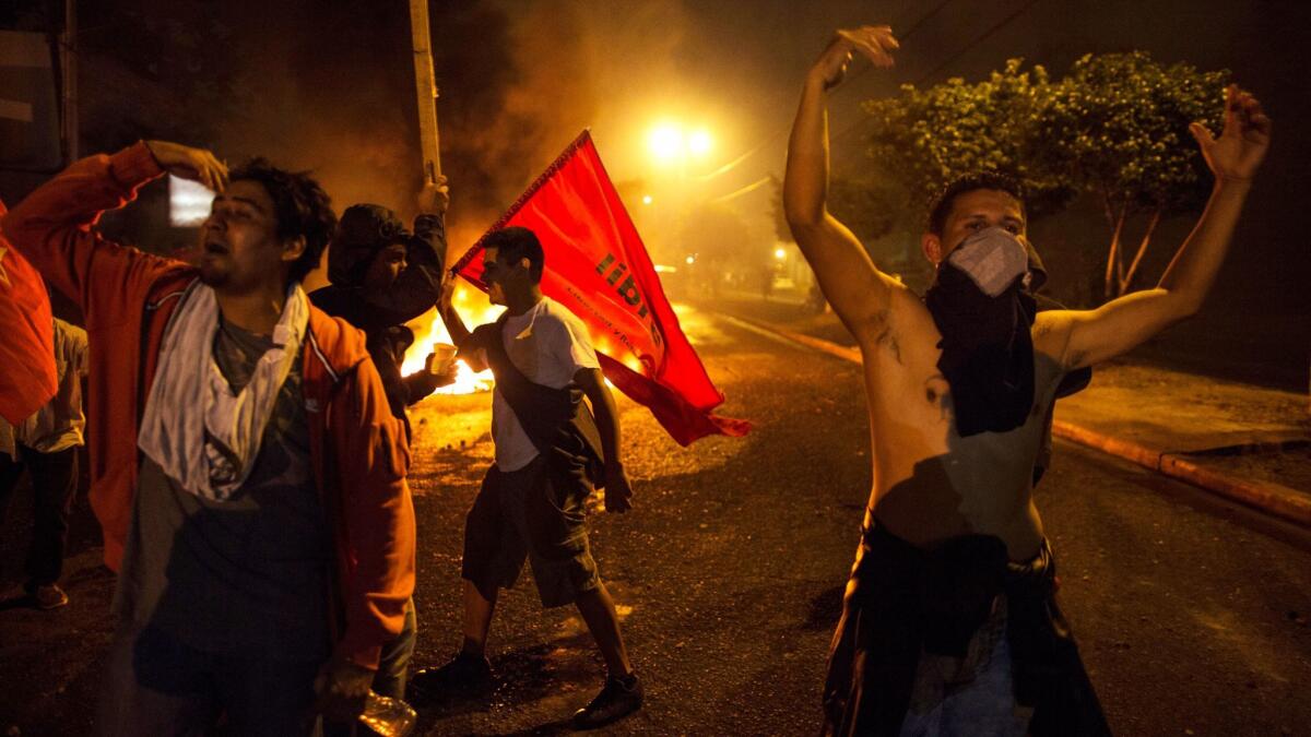 Supporters of presidential candidate Salvador Nasralla clashed with police overnight outside the electoral court in Honduras.