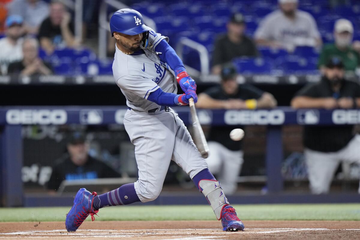 Dodgers' Mookie Betts bats during the first inning against the Miami Marlins.