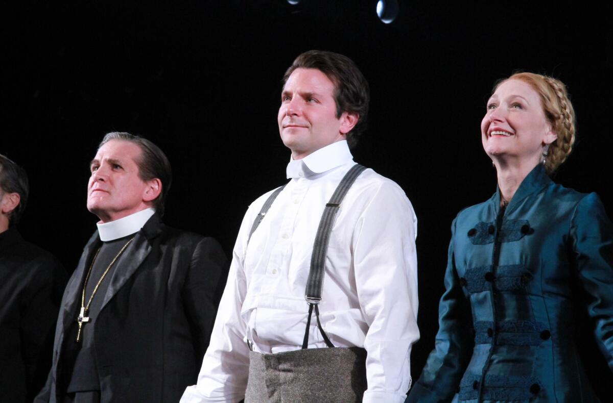 From left are Anthony Heald, Bradley Cooper and Patricia Clarkson at a Nov. 7 curtain call for "The Elephant Man" at the Booth Theatre in New York.