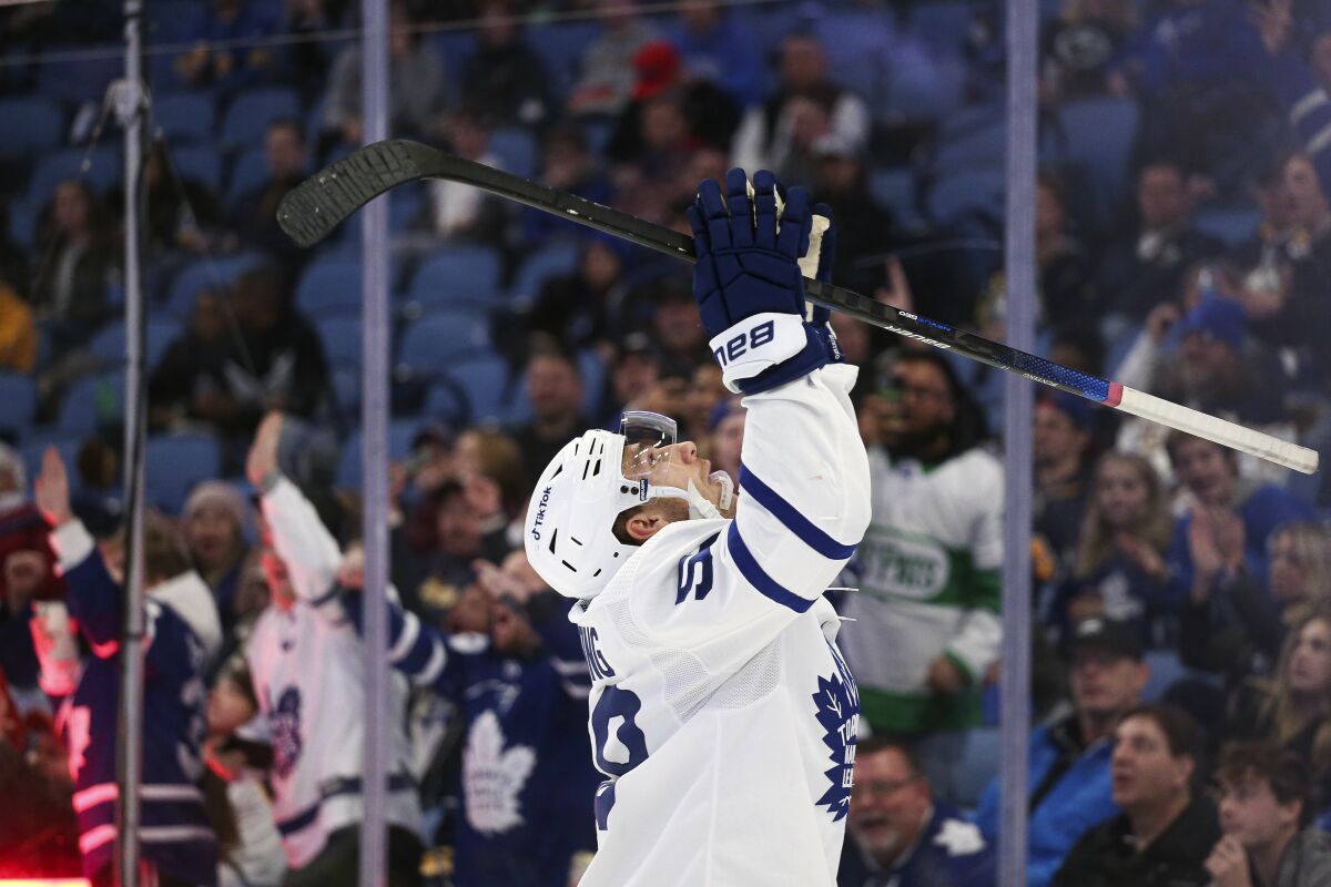 Toronto Maple Leafs left wing Michael Bunting (58) celebrates his goal during the second period of an NHL hockey game against the Buffalo Sabres on Saturday, Nov. 13, 2021, in Buffalo, N.Y. (AP Photo/Joshua Bessex)