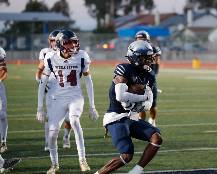 Madison's Berrot Rankin scores a touchdown in the first half of Friday night's game against Steele Canyon.