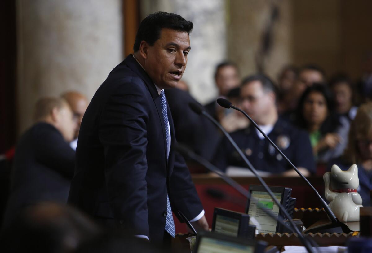 L.A. City Councilman Jose Huizar stands at a microphone