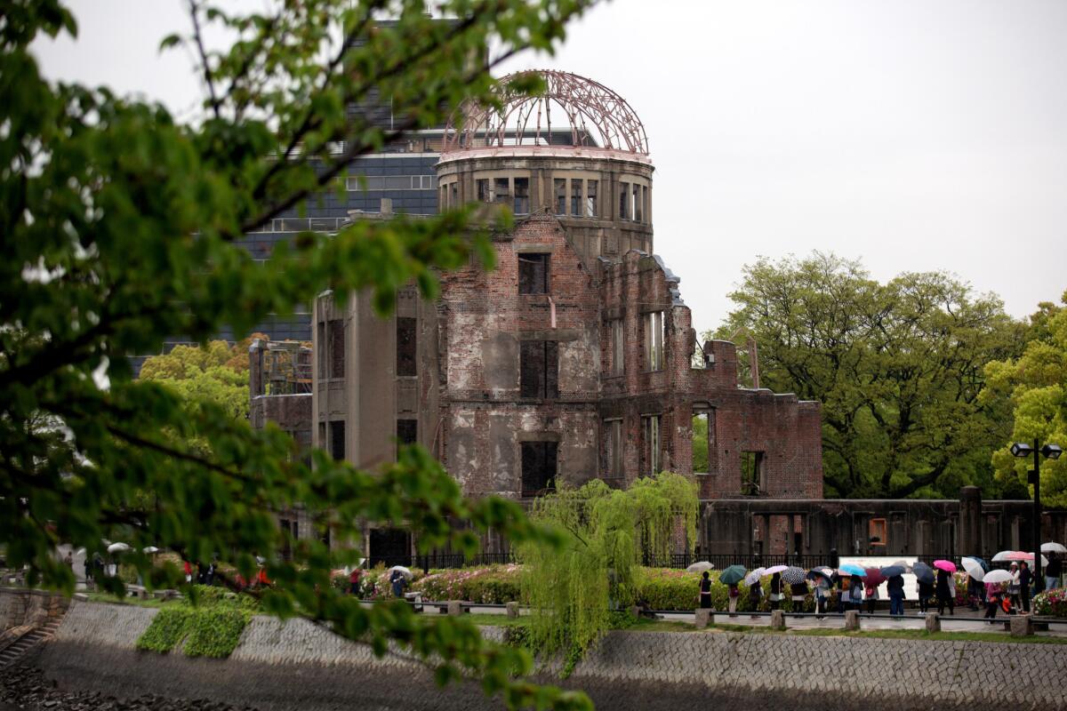 Tourists visit the Atomic Bomb Dome on April 21, 2016, in Hiroshima, Japan. President Obama will visit the city later in May.