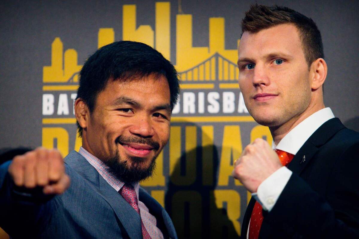 Philippine boxer Manny Pacquiao (L) and Australian challenger Jeff Horn pose after a press conference to promote their upcoming WBO welterweight boxing title fight at Suncorp Stadium in Brisbane on June 28, 2017. Manny Pacquiao's world title fight with Jeff Horn will be "short and sweet" with a knockout likely, his trainer predicted on June 28, as his Australian challenger said he was "ready for war". / AFP PHOTO / Patrick HAMILTON / -- IMAGE RESTRICTED TO EDITORIAL USE - STRICTLY NO COMMERCIAL USE --PATRICK HAMILTON/AFP/Getty Images ** OUTS - ELSENT, FPG, CM - OUTS * NM, PH, VA if sourced by CT, LA or MoD **